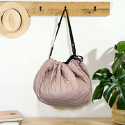 MiniDream storage bag with removable and adjustable shoulder strap for hanging the bag.