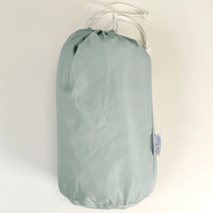 MiniDream double uses a playmat store in a sage green bag.