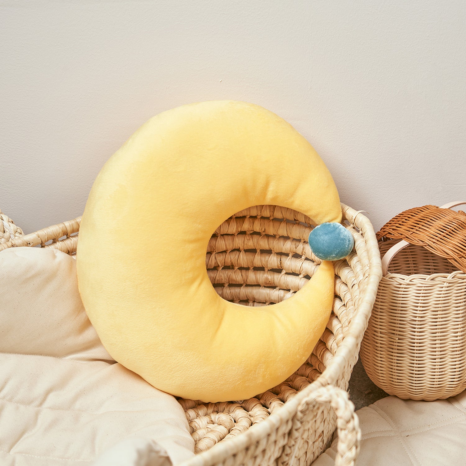 Happy rainbow moon cushion styled in a modern nursery.