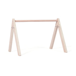 Neutral-toned nursery with Montessori activity gym frame for infants