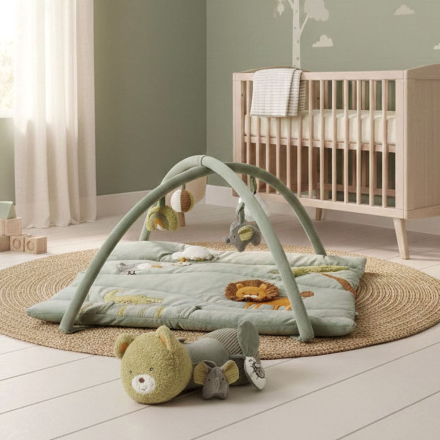 This activity gym can be paired with the MiniDream tummy time roller.