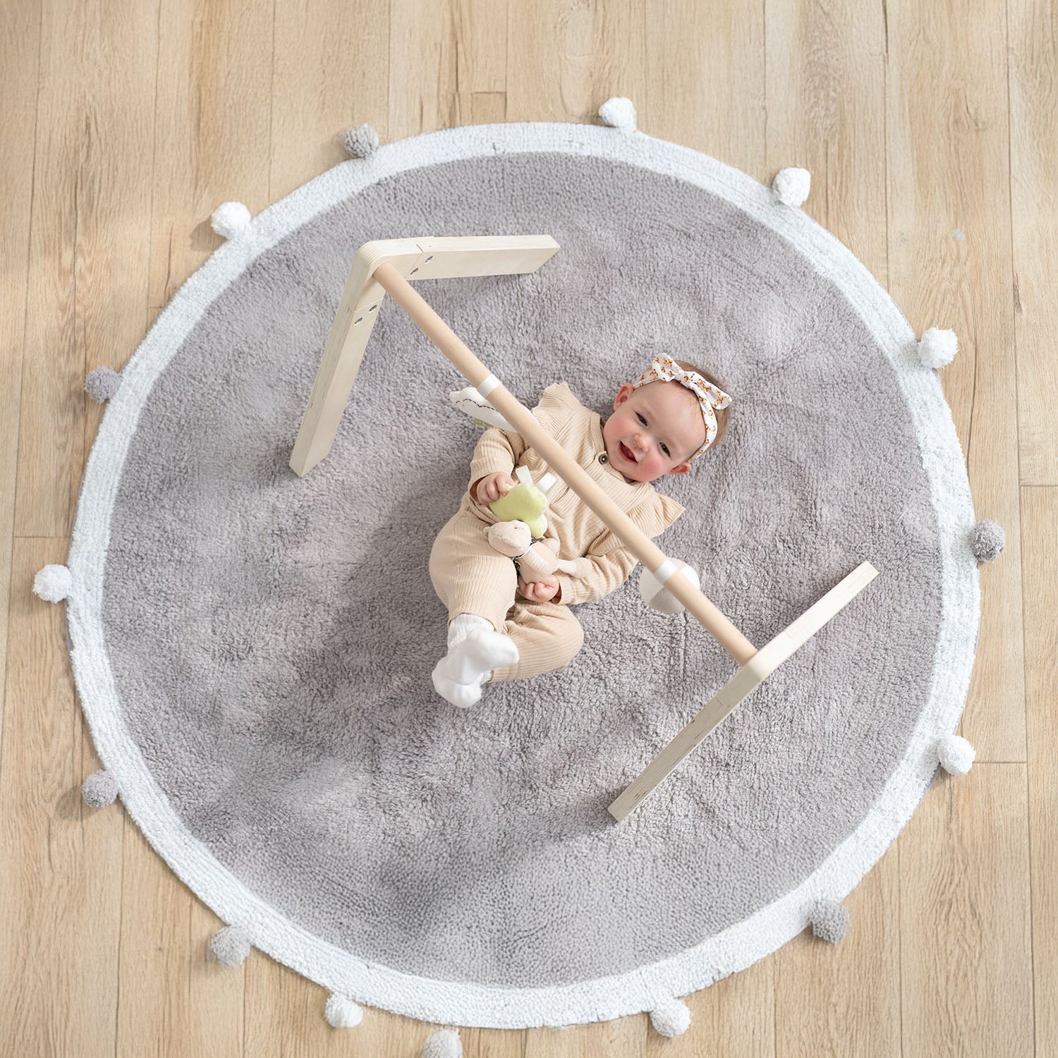Wooden baby gym frame with interactive sensory toys for infants
