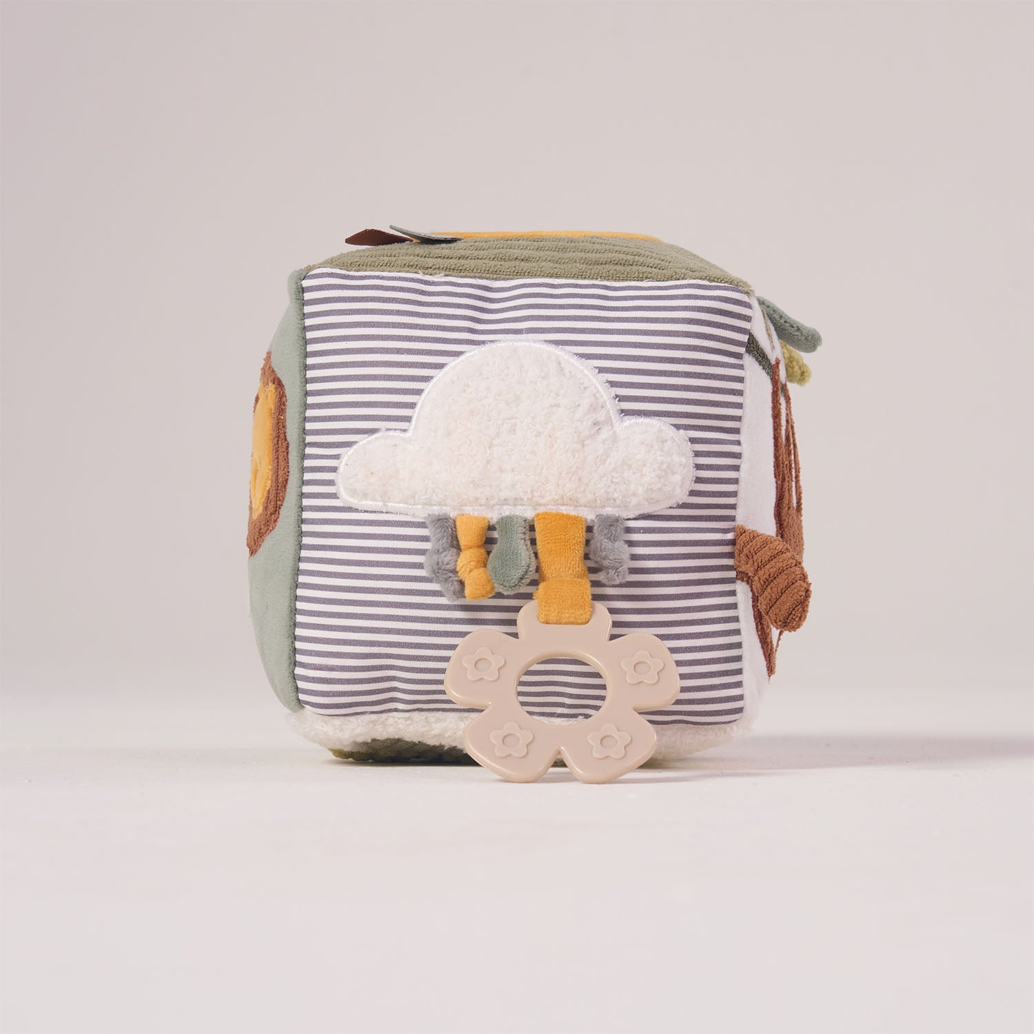 Striped side of the MiniDream soft activity cube featuring a plush cloud, crinkly jungle leaves, and an attached baby teether.