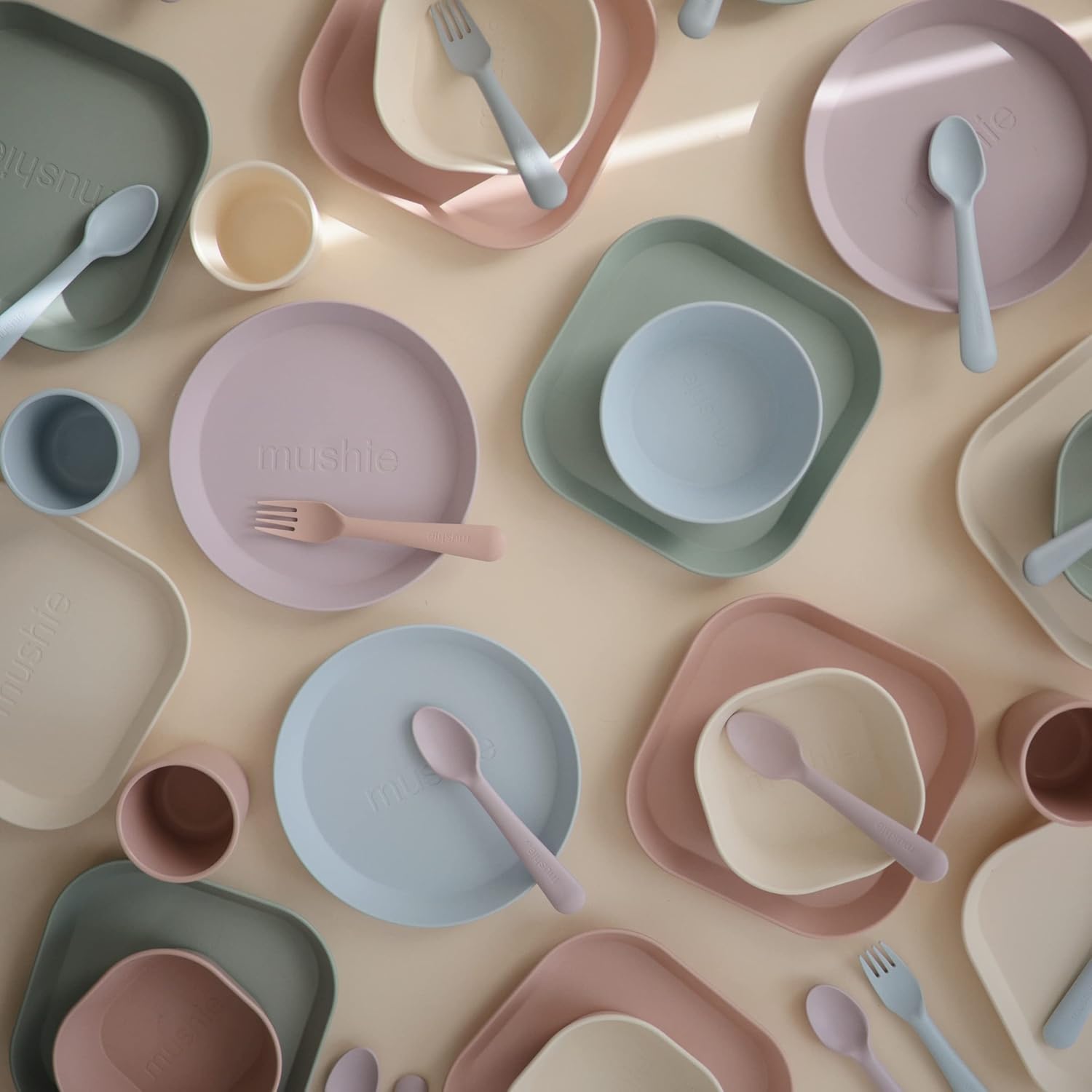 Mix match of fork and spoon with dinnerware plates.