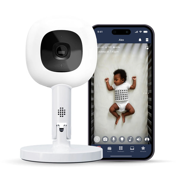Nanit Pro Camera on Flex Stand, showing a baby sleeping peacefully