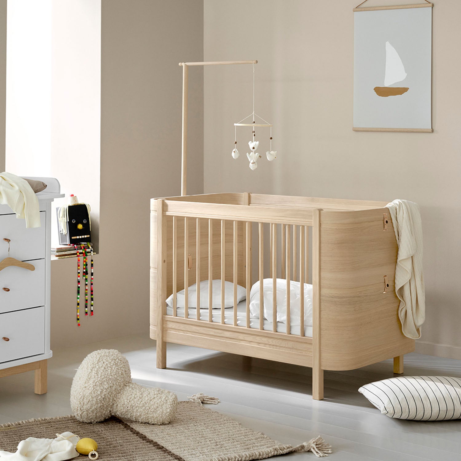 Durable oak wooden cot bed for small nursery spaces