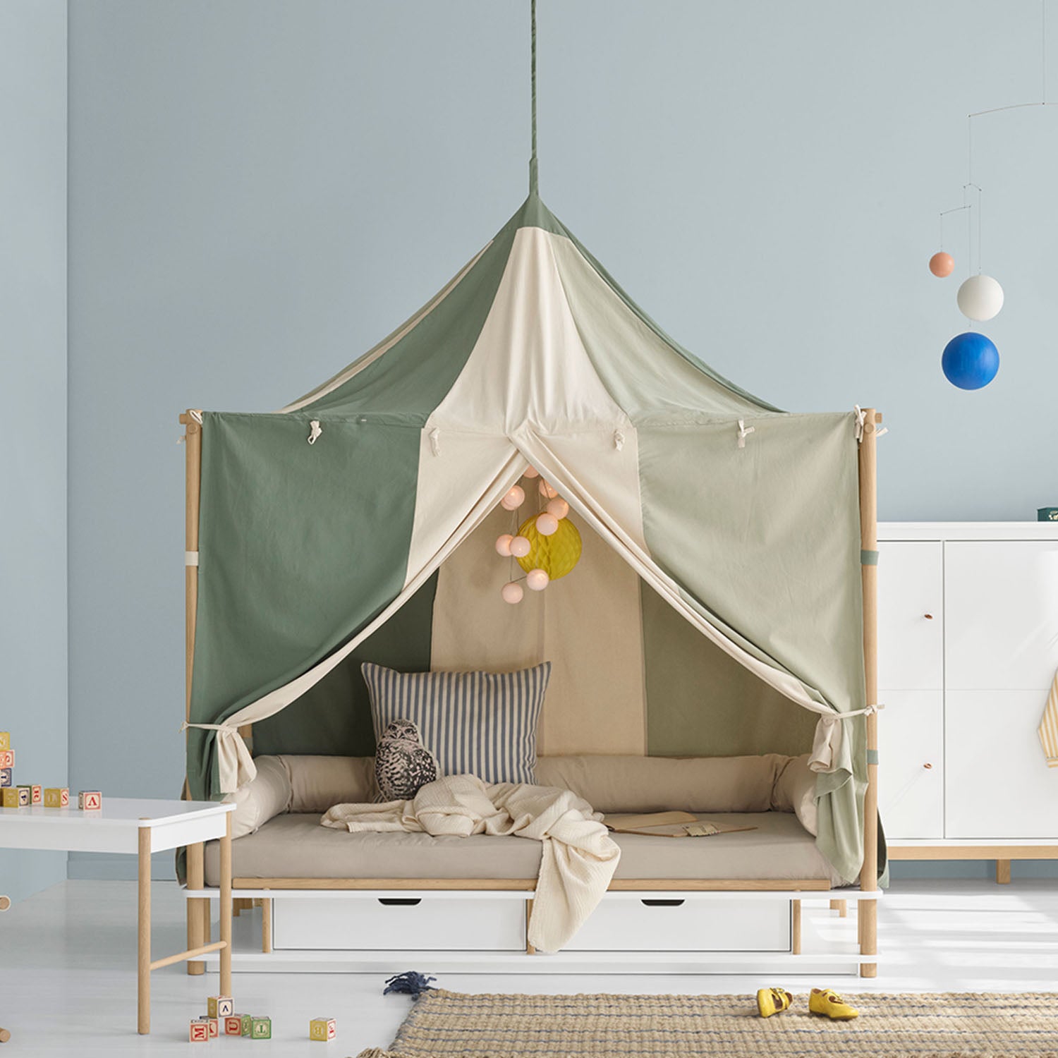 Oliver Furniture Camp Bed Canopy Sahara made from semi-transparent organic muslin cotton over a children’s bed