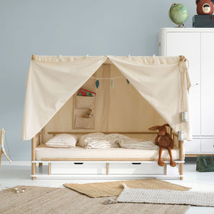 Detail of natural fabric texture showing breathable organic cotton material used in the canopy