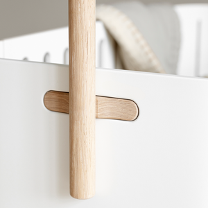 Functional wooden holder designed for baby sleep and comfort setup