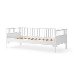 Elegant white day bed with simple, clean Scandinavian design.