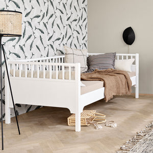 Spacious single bed suitable for a child, guest, or lounge area