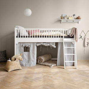 White low loft bed designed for children with a simple Scandinavian style