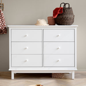Wooden dresser with six spacious drawers for children’s room storage.