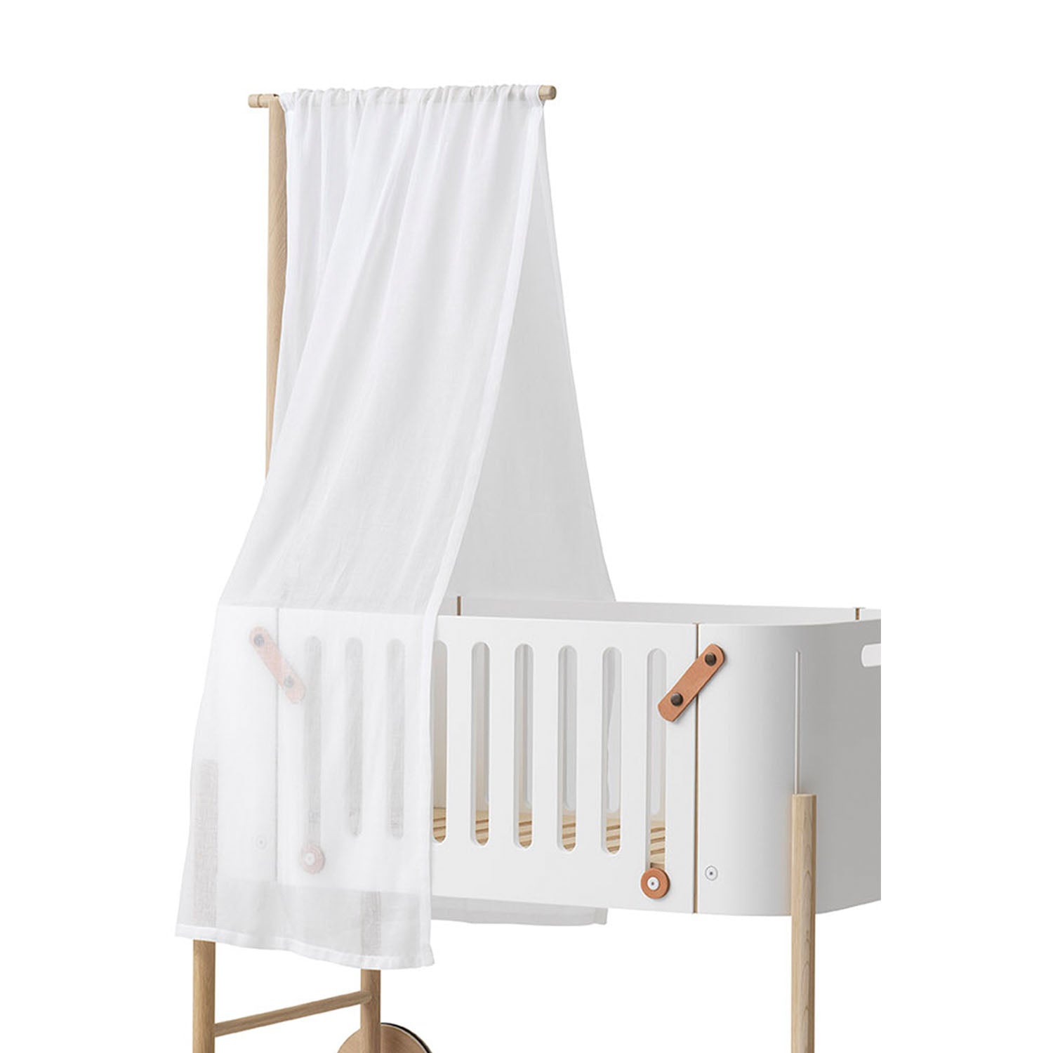 Co-sleeper bed transformed with a gentle canopy for light and draft protection