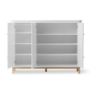 Interior of cupboard showing shelves and hanging rod