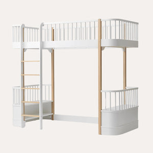 Children’s loft bed with white frame and natural oak legs
