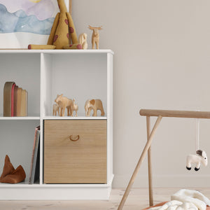 Organised kids’ shelf with soft toys and storybooks displayed neatly