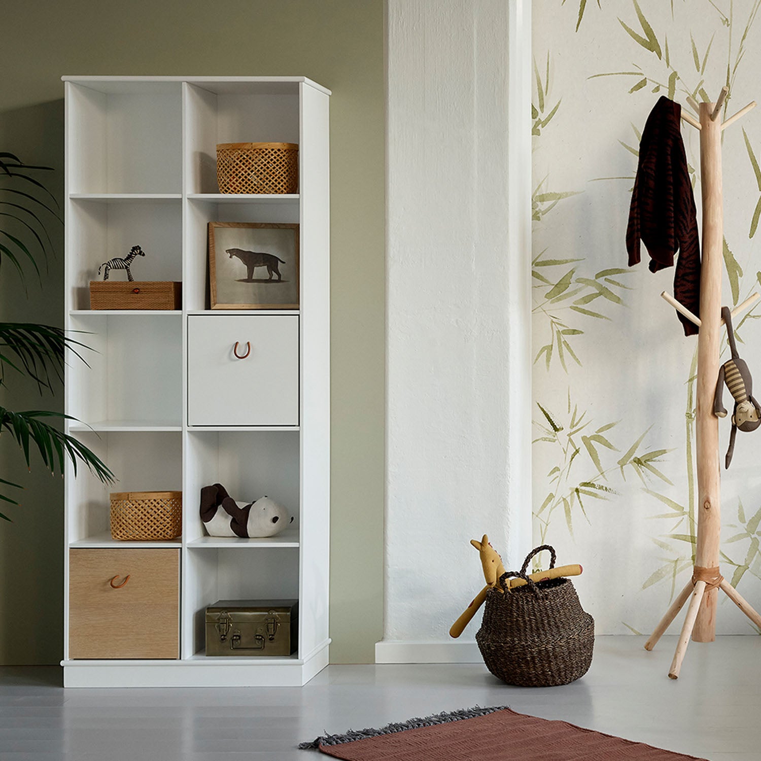 Kids room storage shelf with books and toys neatly arranged