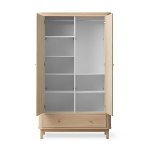 Oak veneer wardrobe with warm wood grain texture