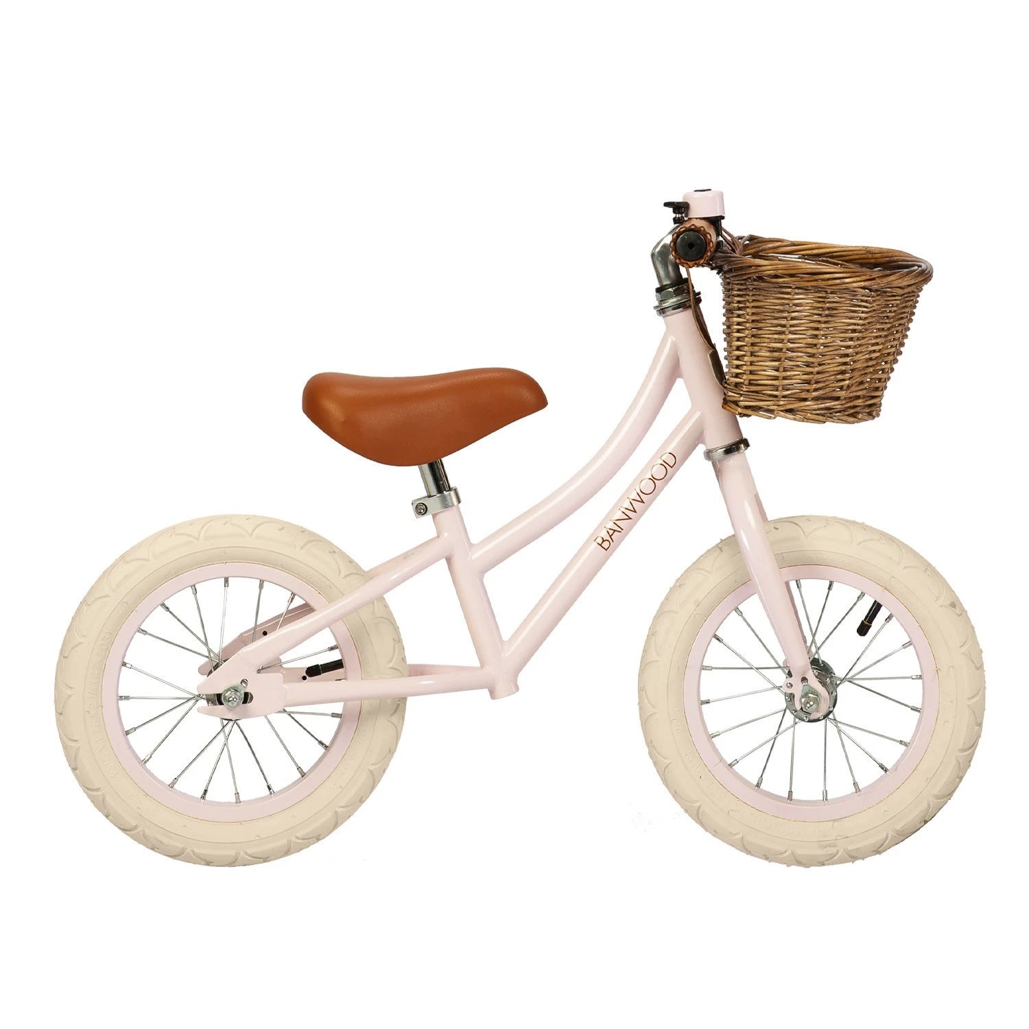 Pink banwood balance bike vintage first go witht basket in a white background.