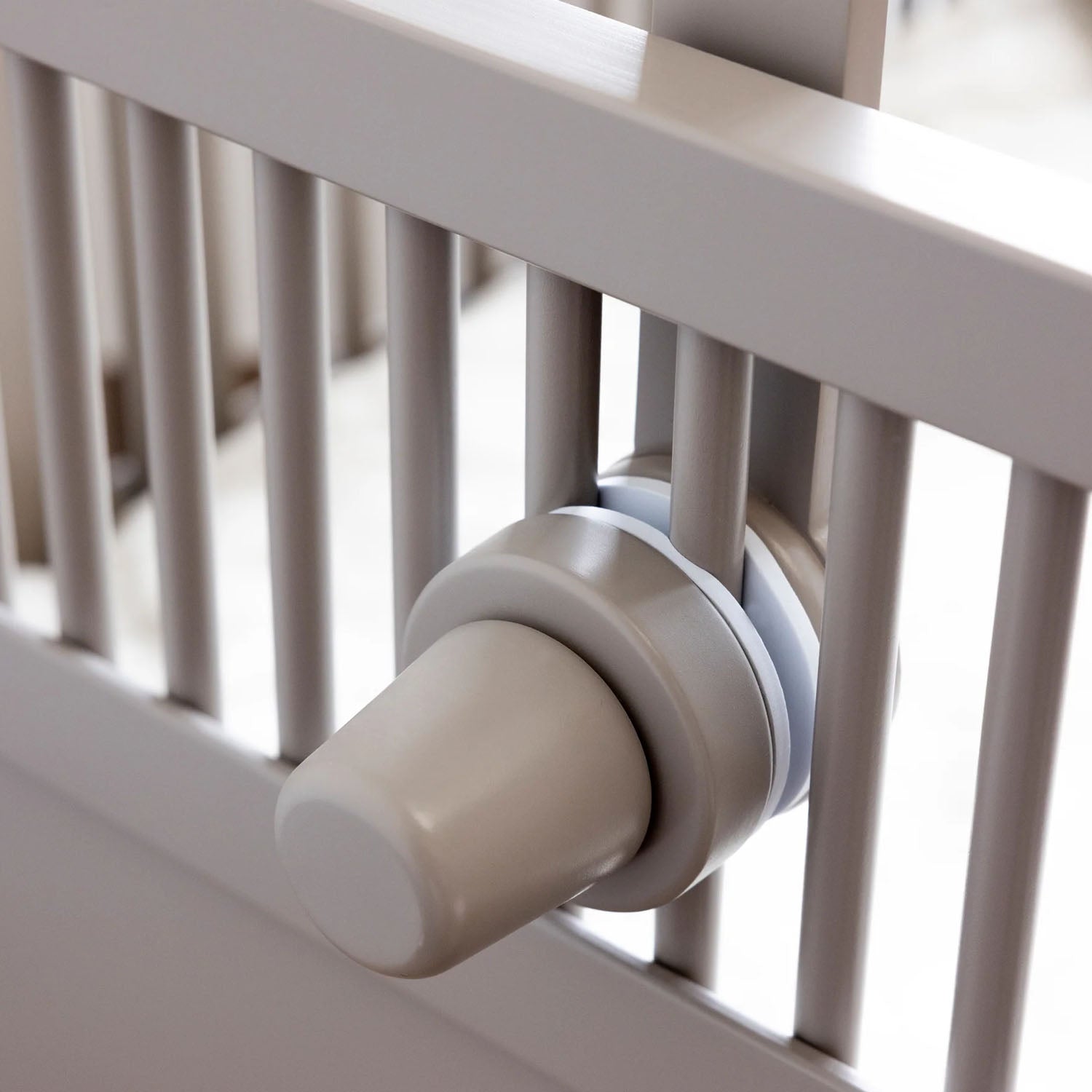 Side angle of Sebra wooden mobile holder showing clamping mechanism.