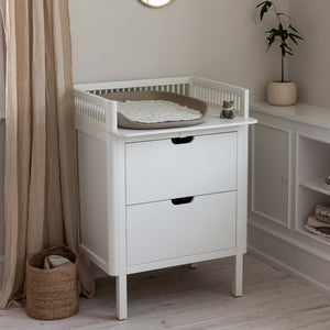 Sebra classic white changing unit shown from side in soft lit room