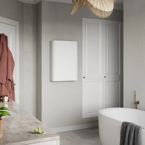 Sebra wall mounted changing table open in grey tiled bathroom