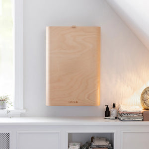 Sebra wall mounted changing table folded against wall