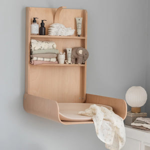 Sebra wall mounted changing table open with shelves in modern nursery
