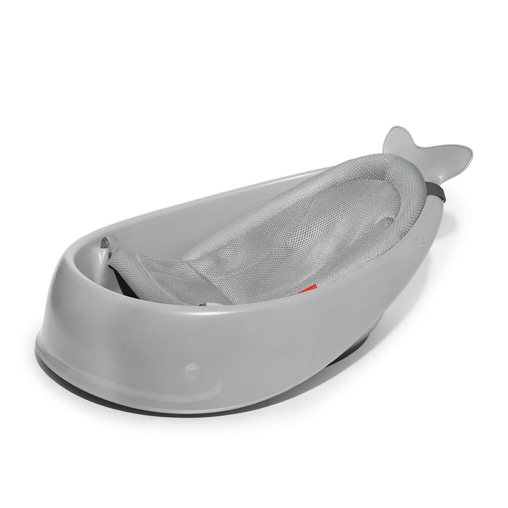 Grey Skip Hop Moby 3-Stage Baby Bathtub with mesh sling in lower infant position.