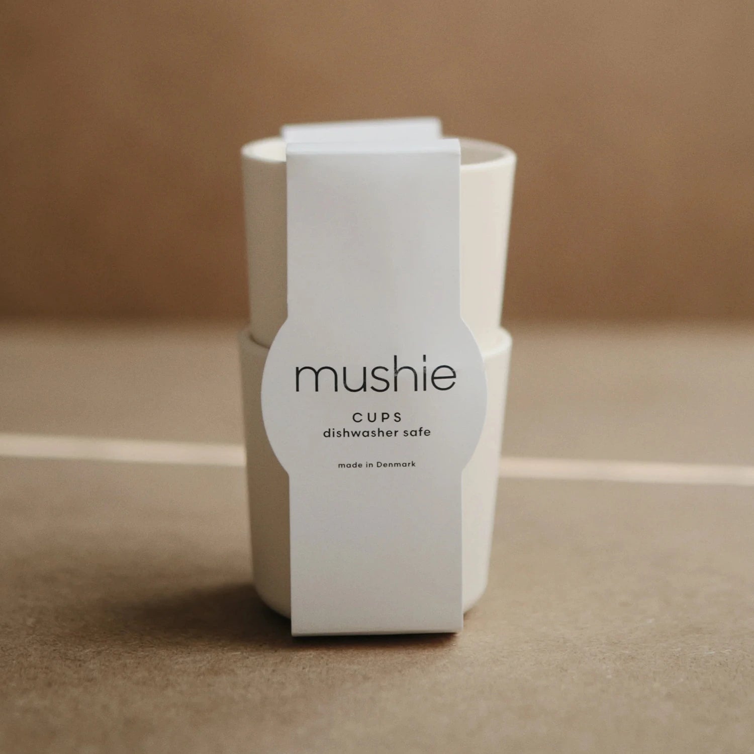 Two baby cups in soft ivory colours