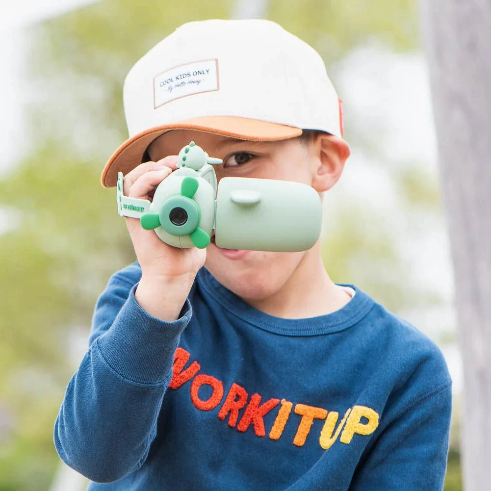 A boy is taking selfies with zoofamily camera