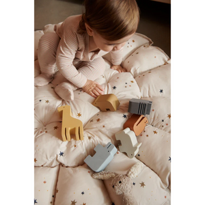 Toddler playing with animal shape sorter thorkild liewood