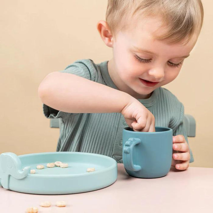 Happy Toddler using Training Cup and Toddler Plate - Dinner Set