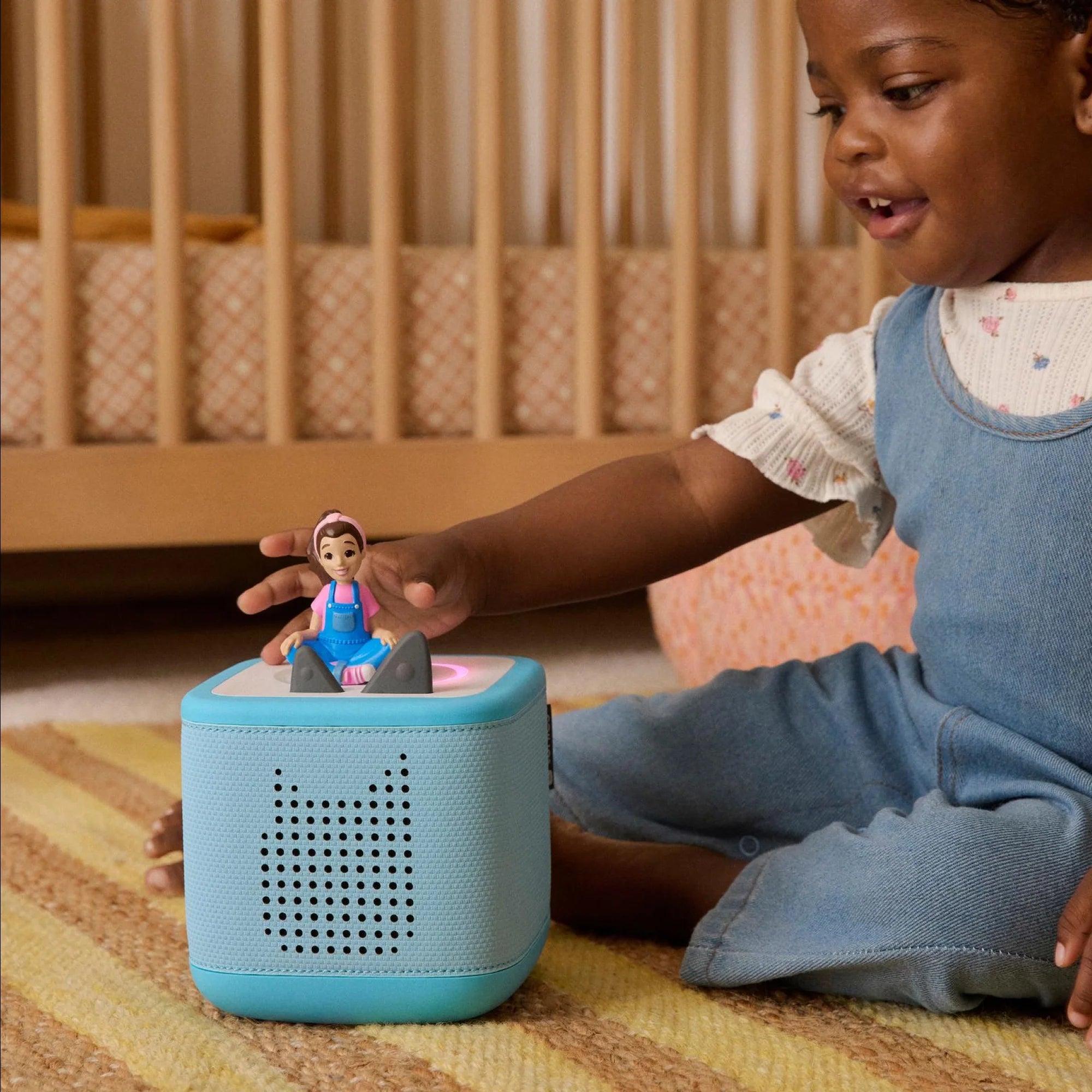 Lifestyle shot of a child listening to the Ms. Rachel Tonie.