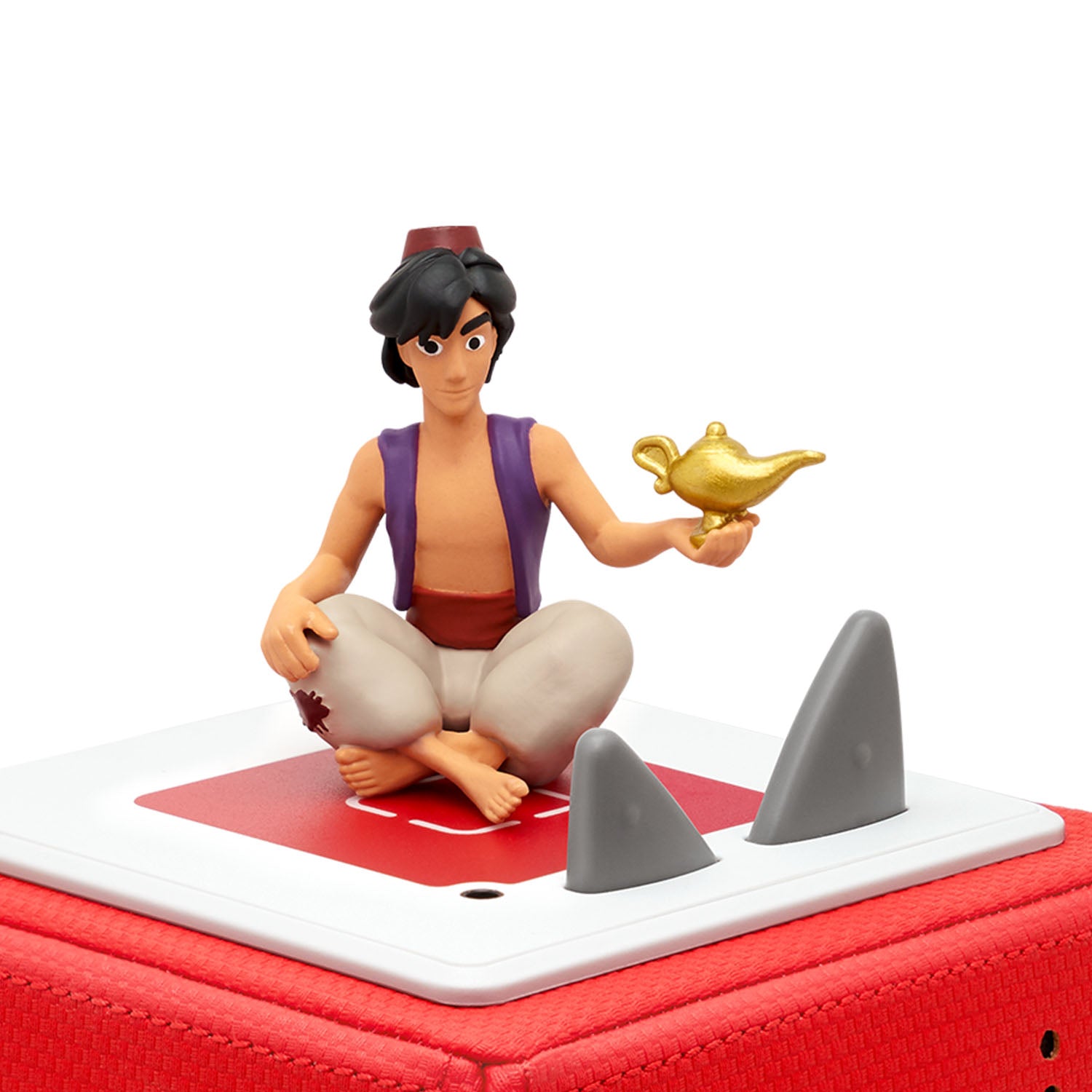 The figure stands securely on a round base that attaches magnetically to the top of a Toniebox player.