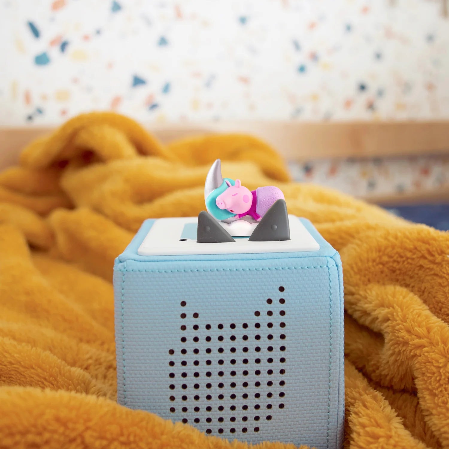 Peppa Pig Tonie placed on top of a Toniebox.