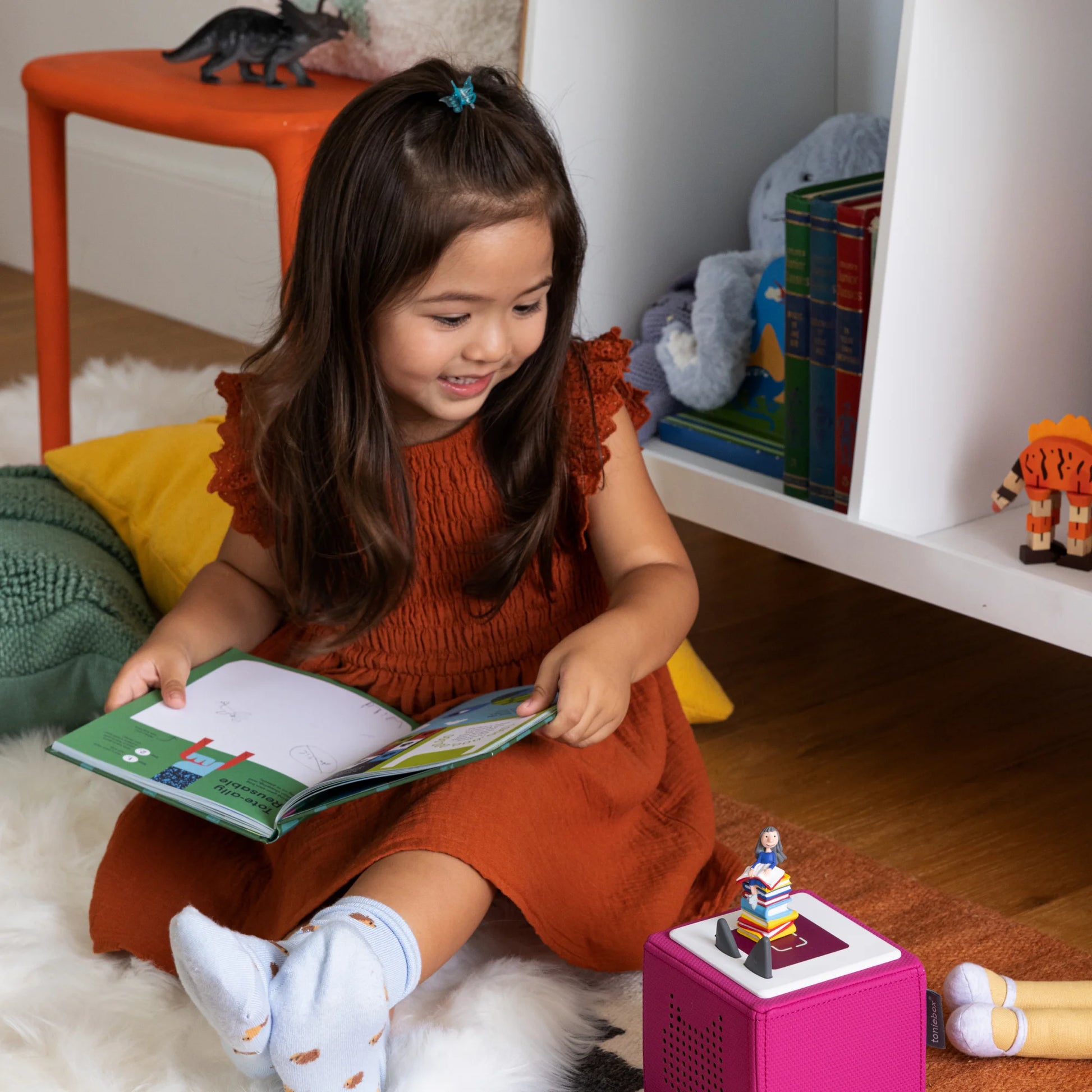 Matilda audio character magnetically attached to the top of a Toniebox speaker.