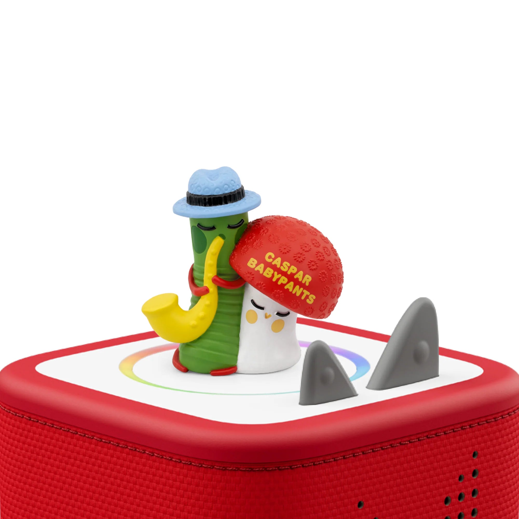 The magnetic Caspar Babypants Tonie figure standing on top of a red Toniebox speaker, ready to play music.