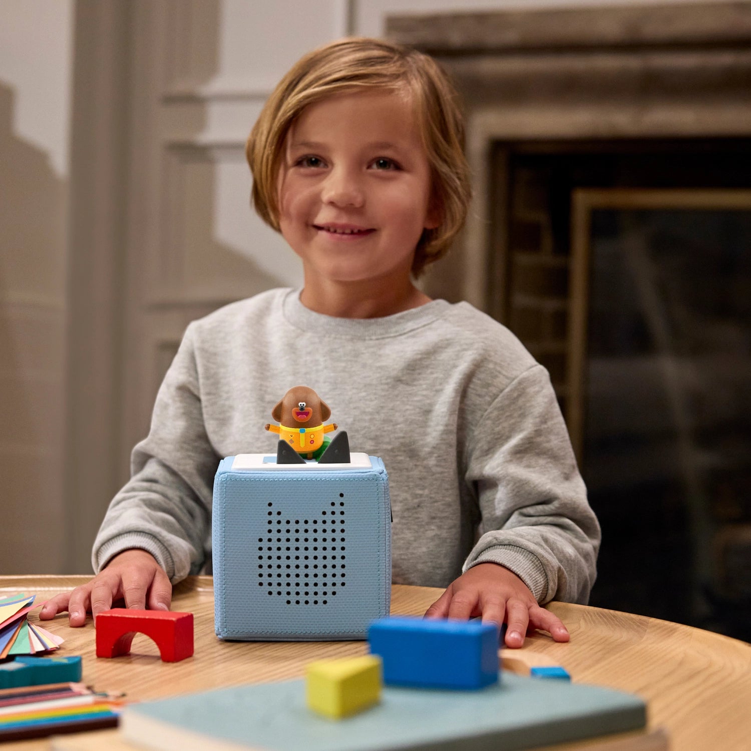 Kids listening to hey duggee stories on Toniebox.