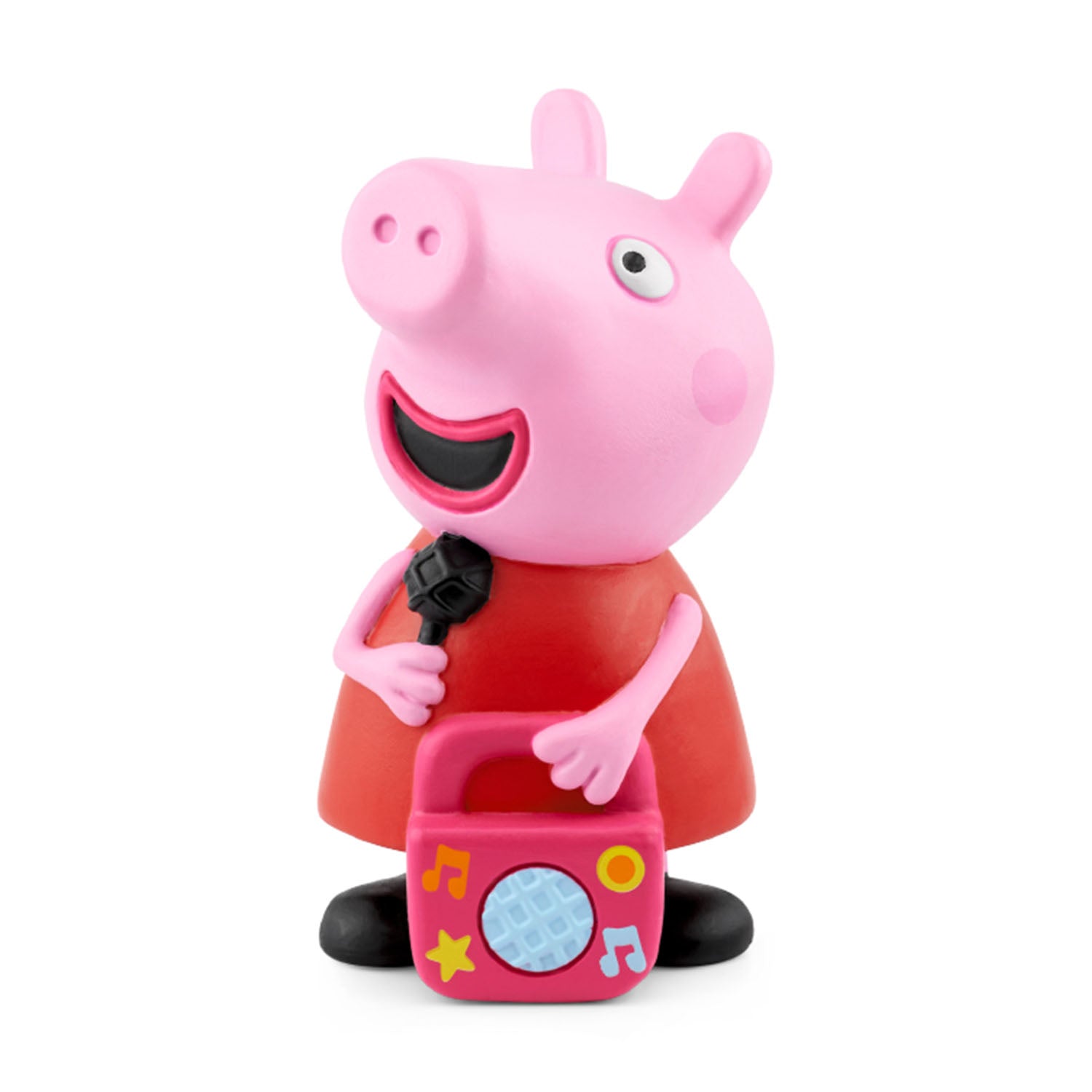 Close-up of a Peppa Pig Tonie figure wearing a red dress, holding a black microphone in one hand and a small pink boombox in the other, set against a plain white background.