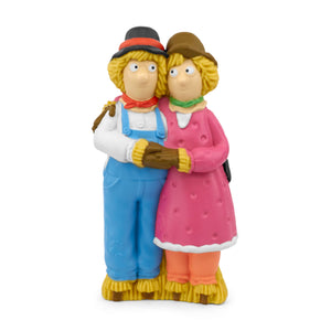 A hand-painted Tonie figurine of Harry O'Hay the scarecrow, wearing a brown hat and a blue bowtie, standing in an upbeat pose.
