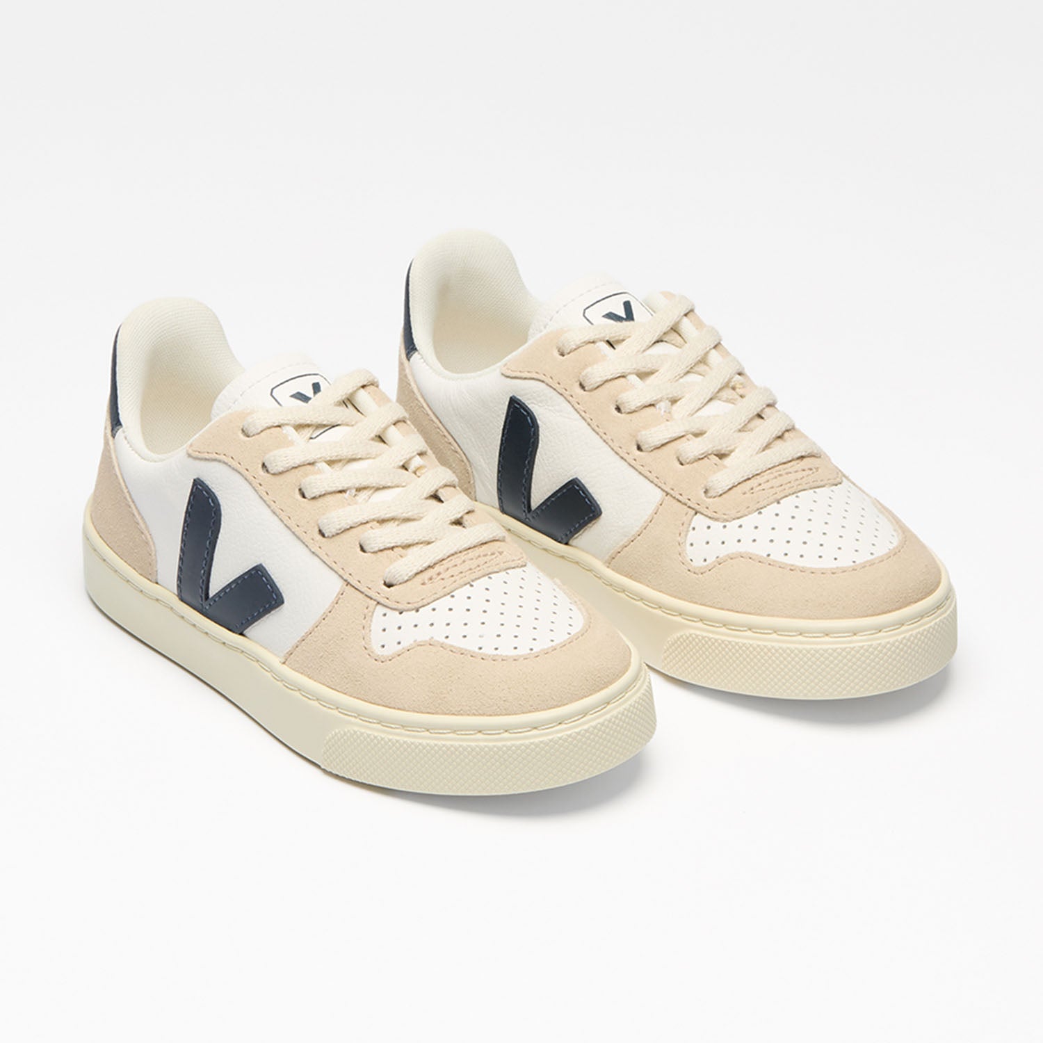 White and almond Veja Kids Trainers full view.