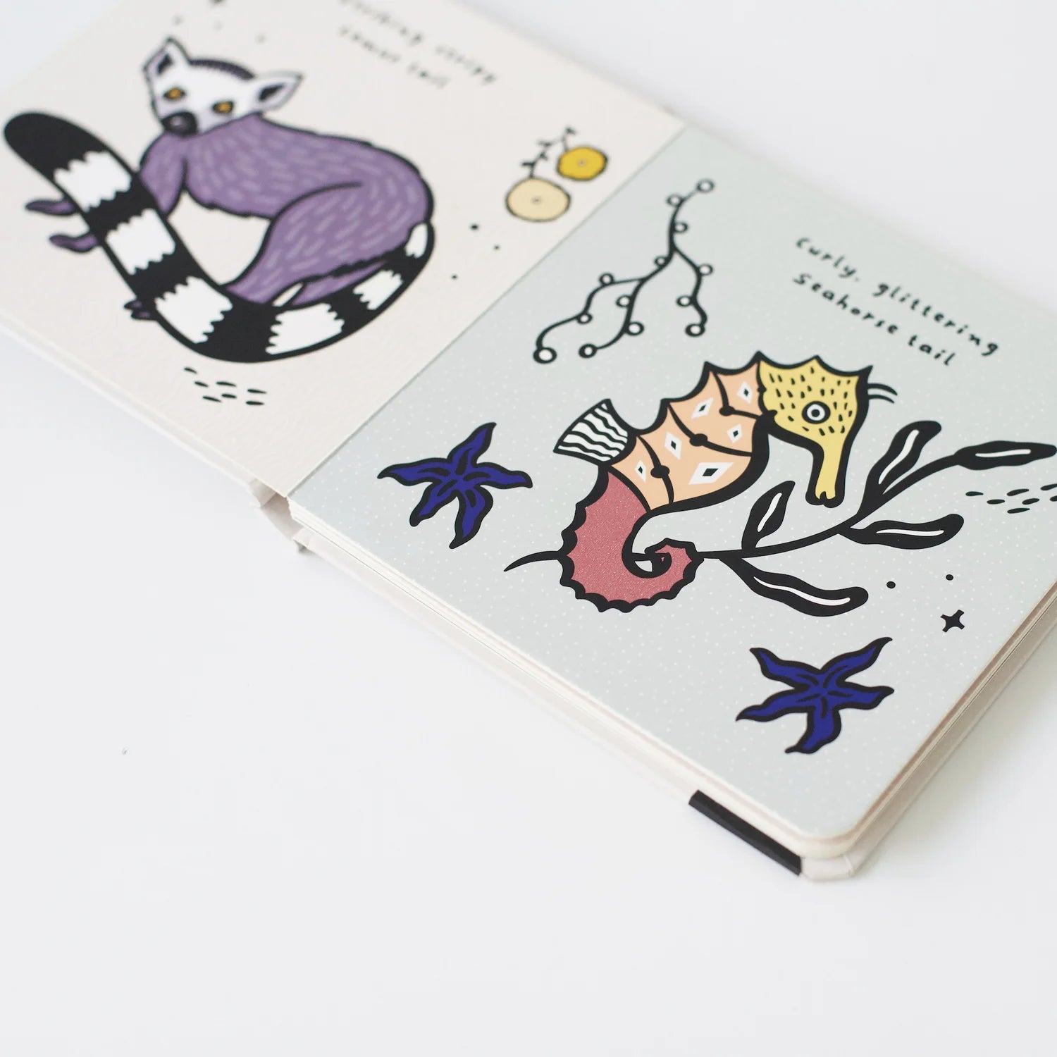 Interactive pages from Tails book featuring different animal tails and textures