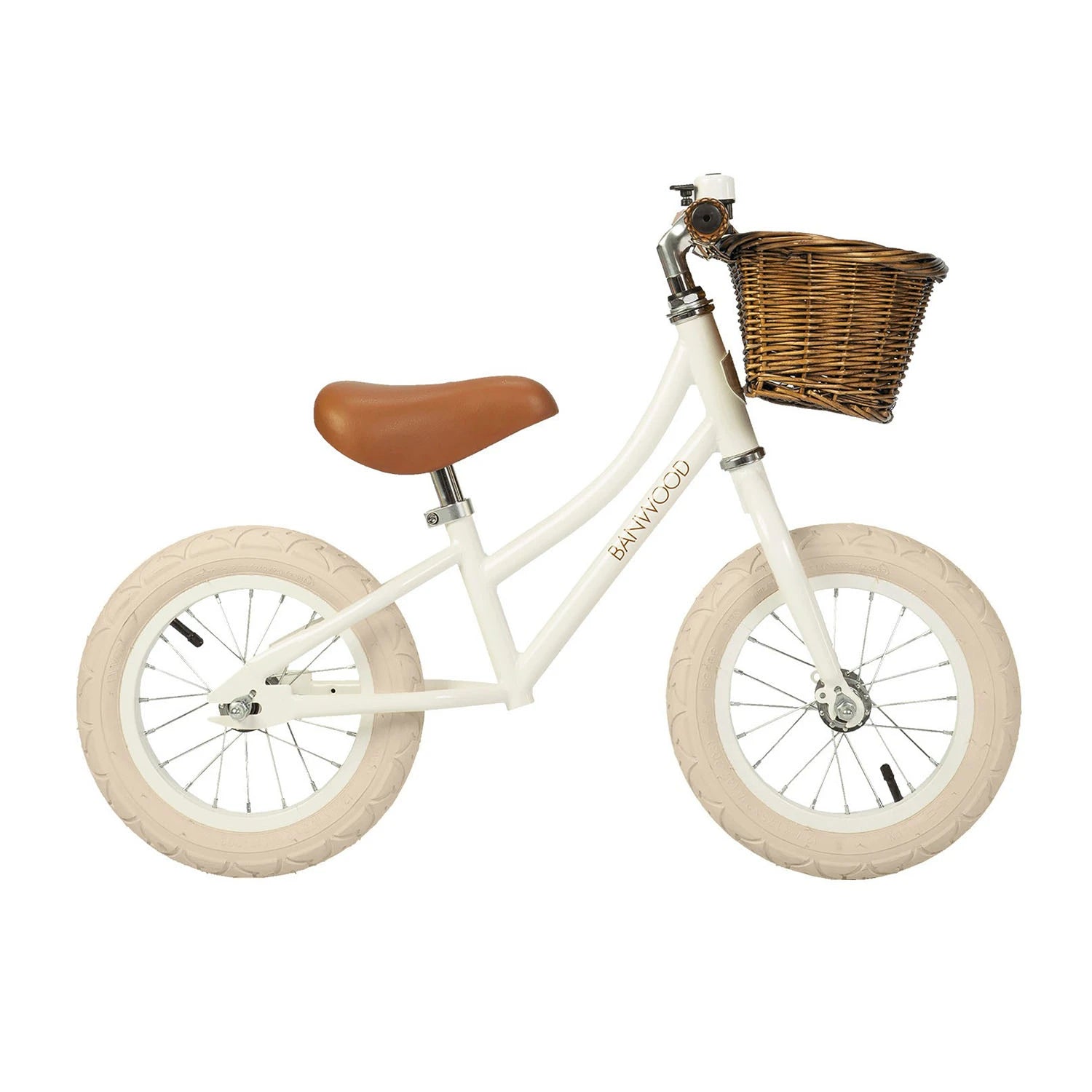 White banwood balance bike vintage first go witht basket in a white background.