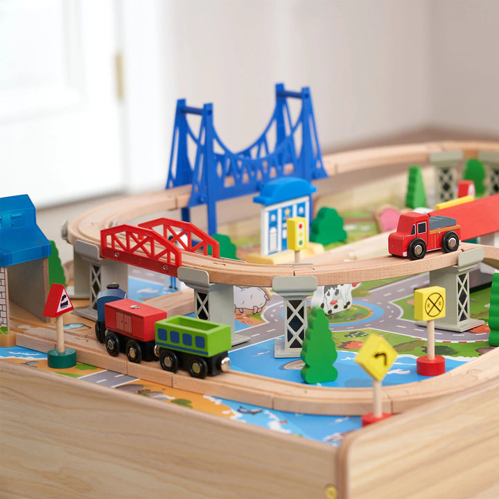 Close-up of the Hooga Wooden Train Set, showing a brightly painted train, wooden bridge, and realistic track pieces.