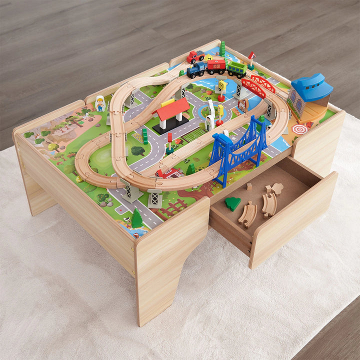 The open storage drawer of the Hooga Wooden Train Set Table, revealing neatly organized track pieces and accessories.