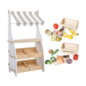 A wooden toy market stall playset with a white and beige striped awning, two wooden display shelves, and assorted colorful toy fruits, vegetables, and crates on a white background.