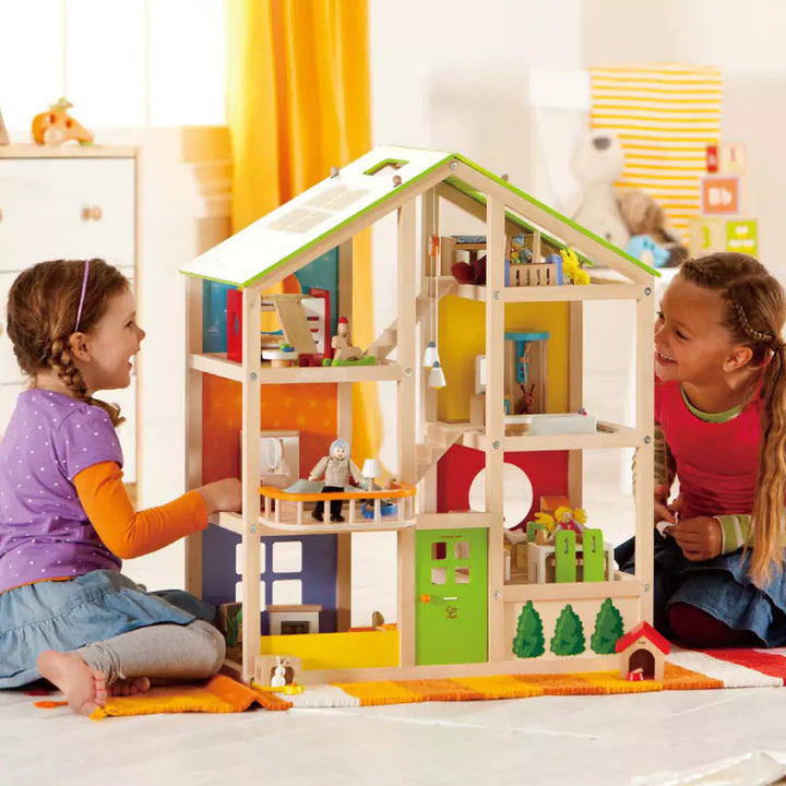 Kids Playing With Wooden Dolls House