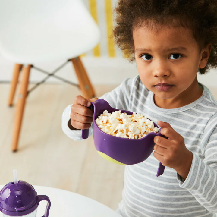 Child happily eating from the B.box Bowl XL + Straw (Passion Splash)